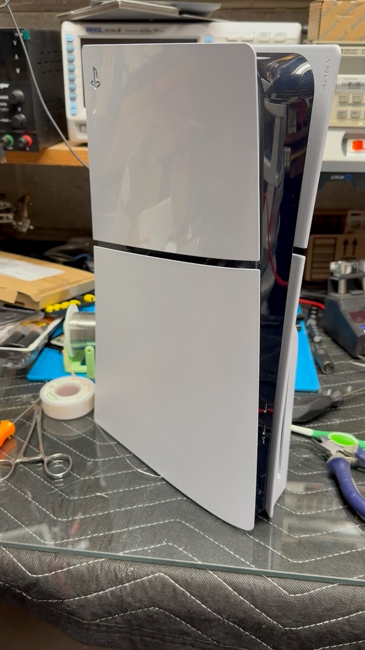 Image of a Playstation 5 on a work bench